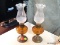 SET OF SMALL OIL LAMPS; SET OF 2 OIL LAMPS EACH WITH PARTIALLY FROSTED FLUTED GLOBE SITTING ON AN