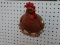 HANGING HEN PLANTER;WALL MOUNTED PLANTER WITH OPEN AREA BEHIND THE HEAD OF A BROWN NESTING HEN WHICH