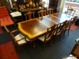 LARGE FORMAL DINING ROOM SET; TABLE AND 8 CHAIRS (2 CAPTAIN'S ARMCHAIRS, AND 6 SIDE CHAIRS). MADE BY