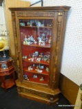 GLASS FRONT WOODEN CORNER CURIO; SOLID HARDWOOD CABINET WITH BURL VENEERS AND REEDED CORNERS, CARVED