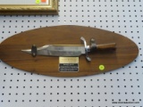 MOUNTED BOWIE KNIFE; AUTHENTIC REPRODUCTION OF THE FAMOUS FIGHTING KNIFE OF JIM BOWIE. IT IS MOUNTED