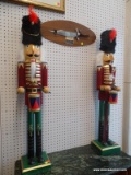 PAIR OF LARGE DECORATIVE NUTCRACKERS; RED, GREEN, BLACK, AND GOLD IN COLOR. WORKING LEVER ON ONE,