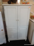 WHITE STORAGE CABINET UNIT; TWO DOORS OPEN TO REVEAL 3 SHELVES (2 ARE ADJUSTABLE). THIS PIECE SITS