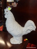 WHITE ROOSTER STATUE; MOLDED WHITE ROOSTER STATUE WITH AMBER COLORED EYE. BOTTOM IS STICKERED 