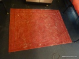 RED AREA RUG; DARK RED MACHINE MADE AREA RUG WITH PATTERNED DESIGN. MEASURES 4 FT 4 IN X 3 FT 3 IN.