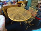 YELLOW PAINTED PATIO SET; OVAL METAL OUTDOOR TABLE WITH 3 METAL OUTDOOR CHAIRS. PAINT IS CHIPPING