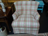 PASTEL PLAID ARMCHAIR; SHADES OF PINK, LIGHT GREEN, AND WHITE PLAID UPHOLSTERY COVER THIS CHAIR,