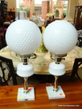 PAIR OF MILK GLASS TABLE LAMPS; WITH ROUND MILK GLASS GLOBES IN A BUTTON PATTERN, AND SQUARE MARBLE