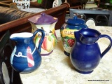 4 PIECE POTTERY LOT; ONE IS A LIGHTHOUSE PATTERNED PITCHER, ANOTHER PITCHER IN SOLID NAVY BLUE,