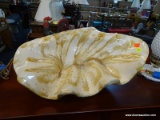 LARGE CERAMIC CLAMSHELL DECOR; WHITE WITH A TAN-GOLD ACCENT THROUGHOUT. MEASURES 20 IN WIDE AND 9.25