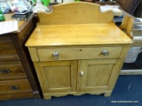 WASH STAND; MAPLE WASHSTAND WITH GALLERY BACK AND 1 DRAWER OVER 2 DOORS. IN EXCELLENT CONDITION AND