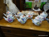 7 TEA POTS; ALL HAVE VARIOUS FLORAL PATTERNS AND ARE IN EXCELLENT CONDITION!