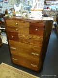 8 DRAWER TALL CHEST; UNUSUAL 8 DRAWER TALL CHEST WITH VARIOUS SIZED DRAWERS. IS MADE OF VARIOUS WOOD
