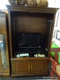 WOODGRAIN ENTERTAINMENT CENTER; RICH WOOD GRAIN ENTERTAINMENT CENTER WITH DENTIL MOLDING ALONG THE