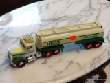 VINTAGE HESS TANKER; WHITE/CREAM AND GREEN HESS GASOLINE TANKER. HAS BATTERY OPERATED LIGHTS AND