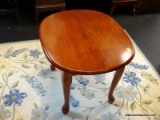 CHERRY QUEEN ANNE COFFEE TABLE; MADE BY AIG DESIGNS, OVAL SHAPED TOP SURFACE WITH 4 CABRIOLE LEGS.