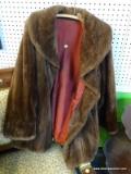 LADIES FUR COAT; RICH BROWN FUR CAT WITH LARGE COLLAR. THIS PIECE HAS A DEEP RED SILK LINING AND THE