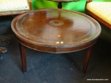 VINTAGE MAHOGANY LEATHER TOP COFFEE TABLE; ROUND COFFEE TABLE WITH LEATHER TOP, AND FLORAL INLAY.