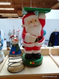 (B1A) SANTA BUTLER; MOTORIZED SANTA BUTLER WITH REMOTE. INCLUDES A TIN SNOWMAN WITH SPRING STYLE