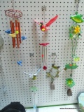 (BACK) WIND CHIMES; TOTAL OF 2. ONE IS CARDINAL THEMED AND ONE DEPICTS A BLUE, WHITE, AND YELLOW