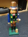 (FL) HOLIDAY NUTCRACKER; IN THE FORM OF A FISHERMAN WITH FISHING ROD AND BUCKET. MEASURES 15 IN