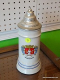 VINTAGE GERMAN BEER STEIN; IS GRAY, GOLD, BLUE, AND RED IN COLOR AND HAS THE NAME 