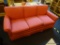 3 CUSHION SOFA; RED 3 CUSHION SOFA WITH REMOVABLE CUSHIONS AND ROLLED ARMS. IS IN VERY GOOD
