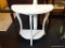 WHITE DEMILUNE TABLE; HAS 1 LOWER SHELF AND IS IN VERY GOOD CONDITION! MEASURES 22 IN X 11 IN X 22