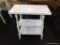 WHITE PAINTED END TABLE; HAS 2 LOWER SHELVES AND HAS A CHIPPY RUSTIC WHITE FINISH. MEASURES 22 IN X