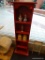 RED BOOKCASE; HAS 6 SHELVES TOTAL AND IS IN VERY GOOD CONDITION. MEASURES 14 IN X 9 IN X 51 IN.