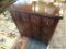16 DRAWER STORAGE CABINET; MAHOGANY CABINET WITH SILVER TONED PULLS. MEASURES 35 IN X 16 IN X 38 IN