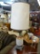 VINTAGE TABLE LAMP; CREAM AND ORANGE GLASS TABLE LAMP WITH BRASS FIXTURES AND A CREAM BARREL SHADE