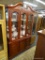 BEAUTIFUL CHERRY CHINA CABINET; THREE PANE, LIGHTED CHINA CABINET IN A BEAUTIFUL CHERRY COLOR. UPPER