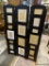 TRI-FOLD STANDING PICTURE FRAME; BLACK STANDING PICTURE FRAME WITH SPACE FOR 18 PHOTOS OF VARIOUS