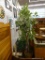 ARTIFICIAL FICUS TREE; LEAVES APPEAR FROSTED. SITS IN A WOVEN BASKET. STANDS APPROXIMATELY 91 IN