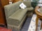 DESIGNER BENCH; CUSTOM MADE DESIGNER BENCH WITH GREEN AND BEIGE UPHOLSTERY WITH TASSELED BASE. WOULD