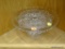 CUT GLASS CAKE STAND; CAKE STAND FEATURES CROSS HATCHING AND STAR CUT DESIGN, WITH A FLUTED EDGE.