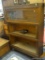 BARRISTER'S BOOKCASE; DARK WOOD BARRISTER'S BOOKCASE. PIECE CONTAINS THREE SHELVES WITH LIFT UP