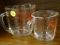ANCHOR HOCKING FIRE-KING MEASURING CUPS; PAIR OF GLASS MEASURING CUPS. LARGE CUP HOLDS UP TO 16 OZ.