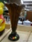 LARGE CARVED VASE; LARGE BROWN DECORATIVE VASE THAT LOOKS LIKE A BLOOMING FLOWER. LOOKS LIKE