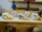 PARTIAL SHELF LOT OF SOUP BOWLS; THIS 5 PIECE LOT INCLUDES HANDLED SOUP MUGS, EACH OF WHICH CONTAIN