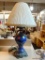 PORCELAIN TABLE LAMP; COBALT BLUE AND GOLD TABLE LAMP THAT RESEMBLES A VASE WITH ITS DOUBLE-HANDLE