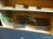 SHELF LOT OF FRYER BASKETS; THIS LOT CONTAINS 7 RECTANGULAR, WIRE FRYER BASKETS WITH GREEN, PLASTIC