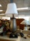 TABLE LAMP WITH POWER OUTLETS; THIS BRUSHED BEIGE AND GRAY TABLE LAMP FEATURES TWO POWER OUTLETS