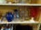 LARGE LOT OF VASES; SOME ARE CLEAR, SOME ARE COBALT BLUE, SOME ARE CRANBERRY COLORED, AND SOME ARE