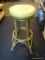 RATTAN STOOL; HAS A VINYL UPHOLSTERED SEAT AND RATTAN STYLE BASE. MEASURES 18 IN X 32 IN