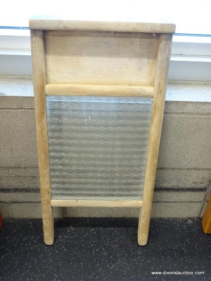 WASHBOARD; VINTAGE COLUMBUS WASHBOARD WITH WOODEN FRAME AND GLASS CENTER. MEASURES 18 IN TALL