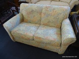 ETHAN ALLEN LOVESEAT; 2 CUSHION LOVESEAT WITH FLORAL UPHOLSTERY AND ROLLED ARMS. IS IN EXCELLENT