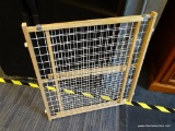 ADJUSTABLE BABY GATE; MADE OF MAPLE AND HARD PLASTIC AND IS IN EXCELLENT CONDITION!