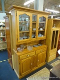 SOLID OAK HUTCH/BUFFET COMBO; IS 2 PIECES. HAS CROWN MOLDING, 2 UPPER GLASS DOORS WITH A CENTER
